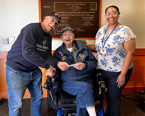 Club Member Bob Porecca and Korean War USN veteran, Sn. Edward Hasslar, Sr., Gabby Gilbert, Life Enrichment Associate